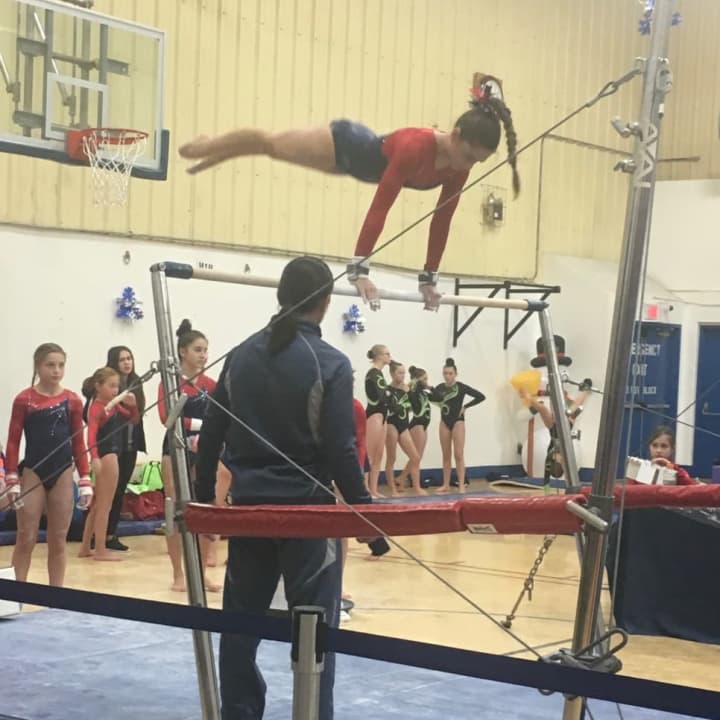 Darien Level 5 gymnast Sofia Imbrogno scored 9.25 to win the bars title for her age group at the Snowflake Invitational in Wilton.