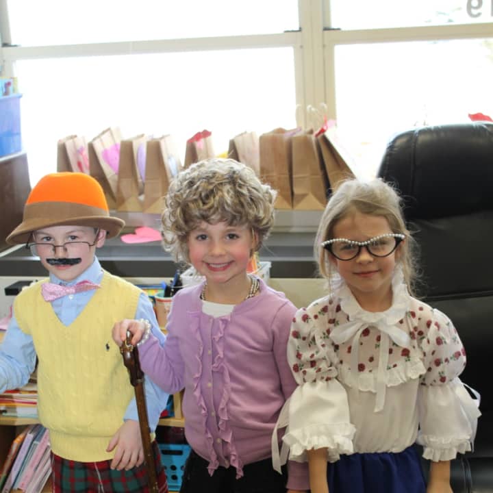 Ox Ridge first-graders Blake DeRiso, Peyton Ochman and Quin Chandler celebrate 100 days of school by dressing up as 100 year olds.