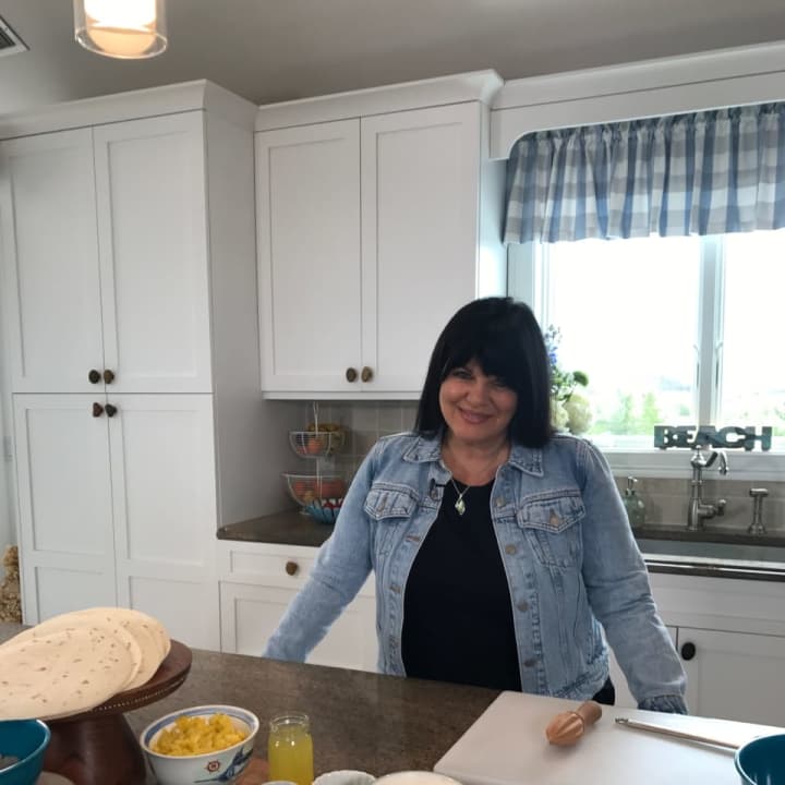 Andrea Anthony prepares a meal in her kitchen for the new PBS series Eat, Drink And Bake with Andrea
