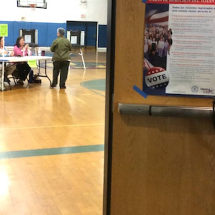 A steady stream of voters head into the War Memorial in Danbury to vote on Tuesday.