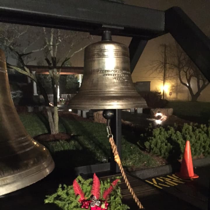 <p>Community members rang the bells Monday outside St. Rose of Lima Church in Newtown after lighting candles in honor of those who died at Sandy Hook Elementary School. </p>
