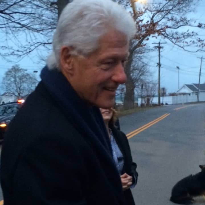 Clinton greets onlookers outside the fundraiser.