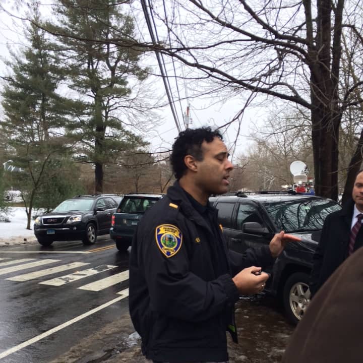 Fairfield Police Lt. James Perez talks to reporters outside 22 Mountain Laurel Road, where a violent domestic attack left one person dead.