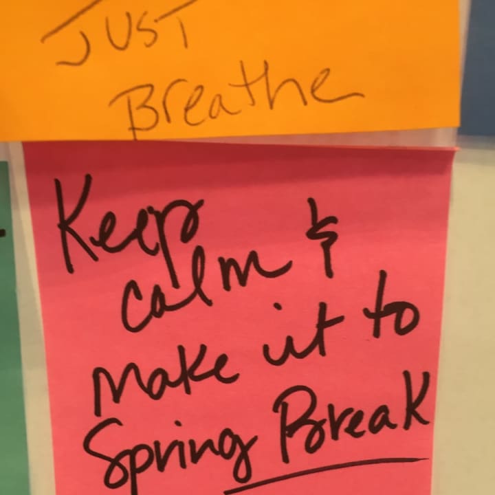 Patrons at Darien Library wrote words of encouragement on sticky notes for Darien High School students studying for midterms. The notes are located on a glass window on the library&#x27;s first floor.