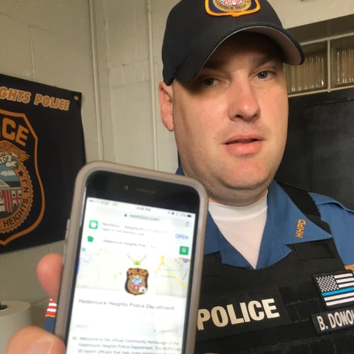 Hasbrouck Heights Patrolman Brian Donohue has the NextDoor app on his phone.