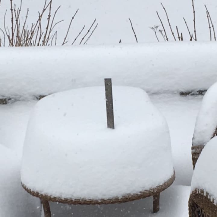 The deck furniture is almost completely buried by snow at this home in North Wilton — and even more snow is headed our way on Thursday.