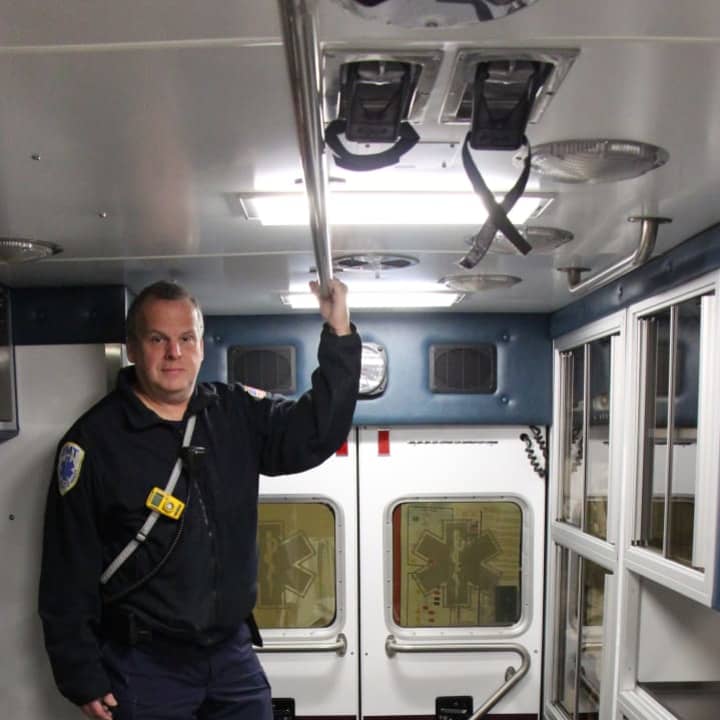 Dumont Volunteer Ambulance Corps&#x27; Captain David Oldewurtel stands in the back of one of the corps&#x27; ambulances.