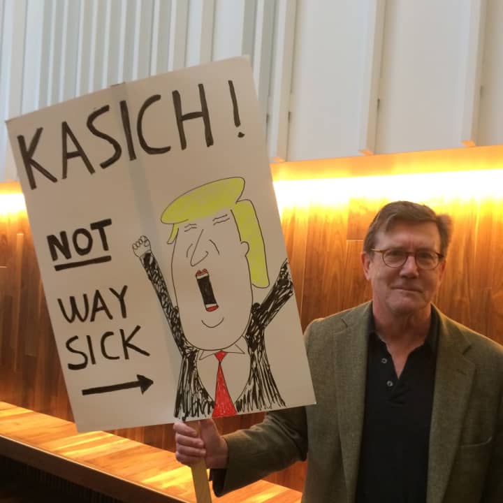 John Mihalic of Fairfield makes his feelings known at a John Kasich Town Hall Meeting in Fairfield.