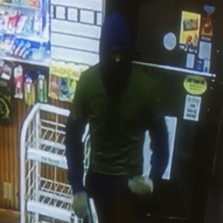 The robber wore a ski mask and gloves and carried a silver handgun.