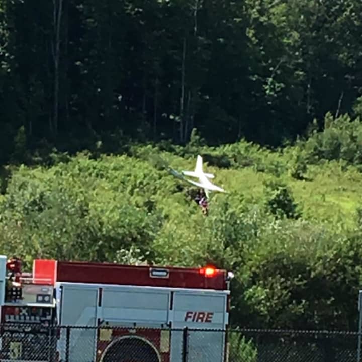 Fire and police are on the scene of plane crash on a hill above the dog park near the Danbury Airport last week.