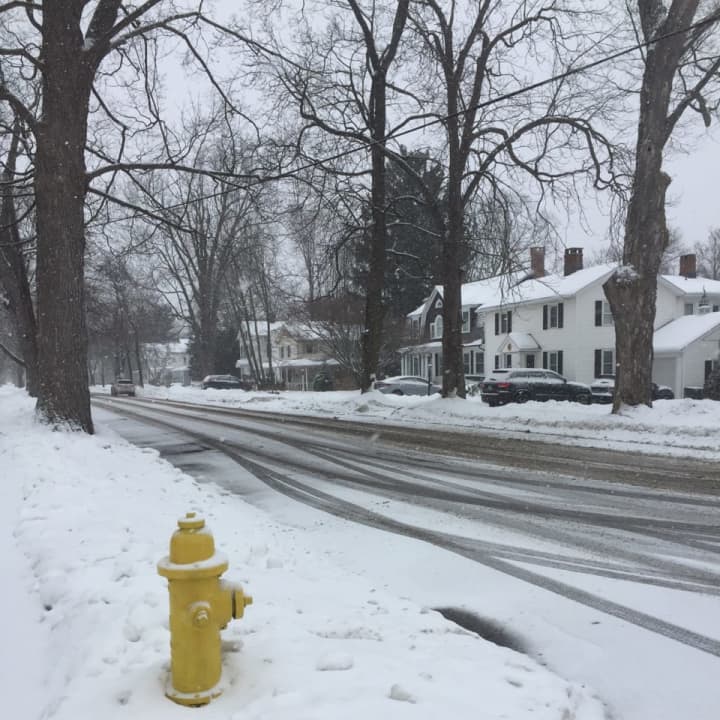 Snow is beginning to coat the roads again across Fairfield County, with another storm moving through on Sunday.