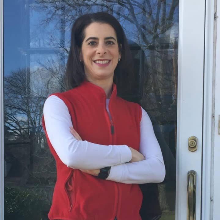 Glen Rock&#x27;s Jessie Schwartzfarb-Lipson wears red to spread awareness on Day Without Women. She stayed home from work on Wednesday. Her bosses are fully supportive.