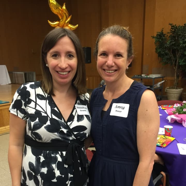 Amy Meer and Jennifer Grant enjoy a breakfast to honor volunteers of Reading Partners in Stamford Wednesday morning at the Jewish Community Center.
