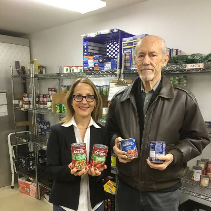 Jennifer Johnson, Director of Communications and Director Relations at the Center for Food Action, received bags of soup from the Northern New Jersey Community Foundation&#x27;s President, Michael Shannon.