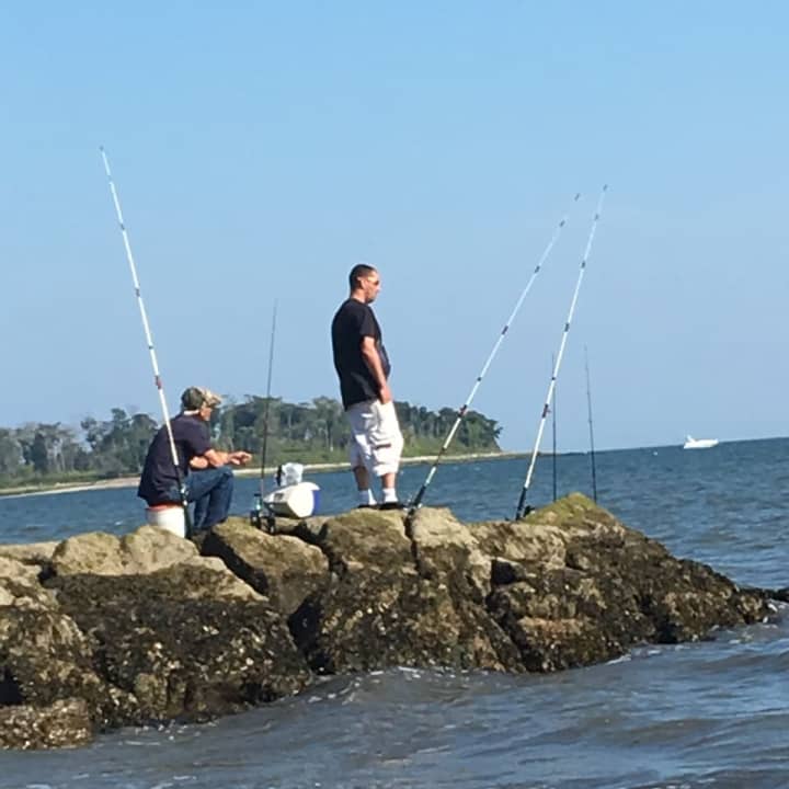 It&#x27;s still warm enough to enjoy fishing along Long Island Sound. These fishermen are at Silver Sands State Park in Milford.