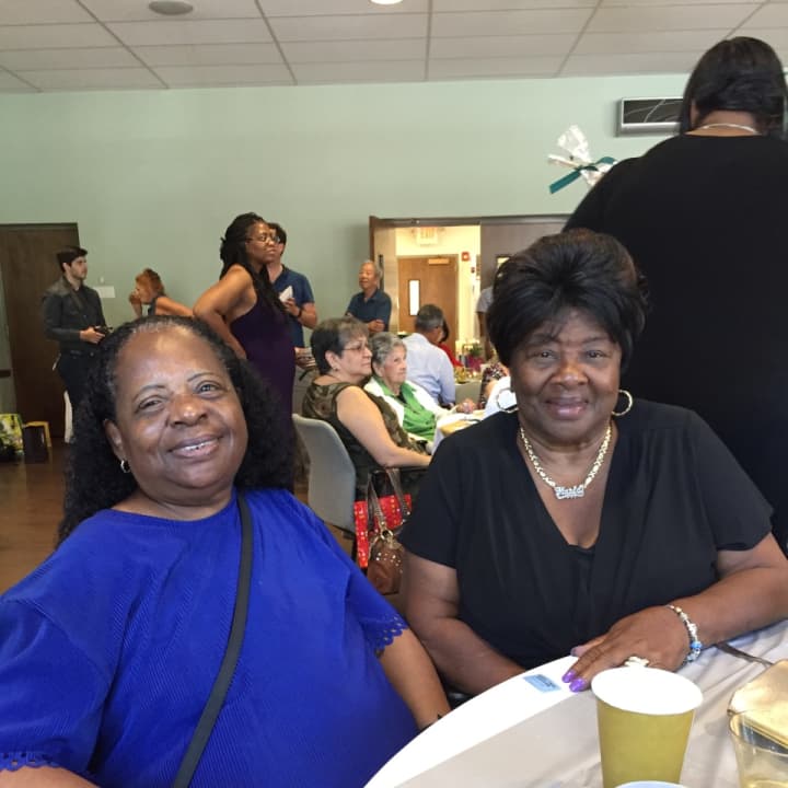 Stamford residents Doris Gantt and Marie Whitaker enjoy a special senior prom luncheon in Stamford Wednesday.