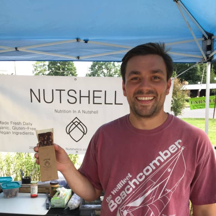 Will D&#x27;Agostino holds one of his healthy nut bars at the Wilton Farmers Market on Wednesday.