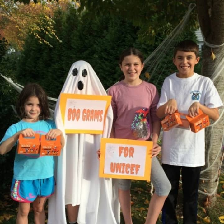 Emily Faucher, James Faucher(ghost), Alex Faucher and Dean Richards, are among many Fox Ridge Elementary students who helped raise $1,000 for UNICEF. 