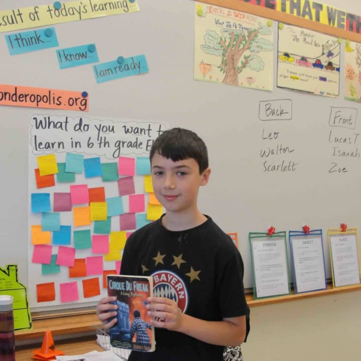 Irvington Middle School sixth-graders give short presentations for their classmates and discuss a book they’ve read. 