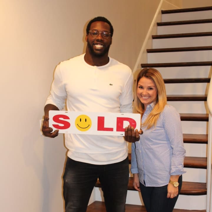 Jason Pierre-Paul and real estate agent Juliana Sullivan in the athlete&#x27;s new Wyckoff home.
