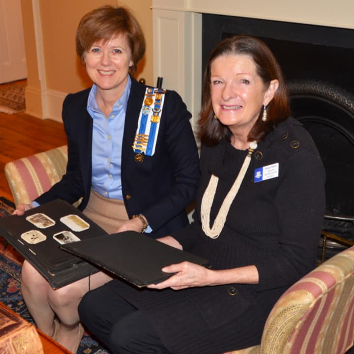 Marge Pavlov and Kathleen Tesluk look at genealogy records. Tesluk helped Pavlov research her family&#x27;s historical past.