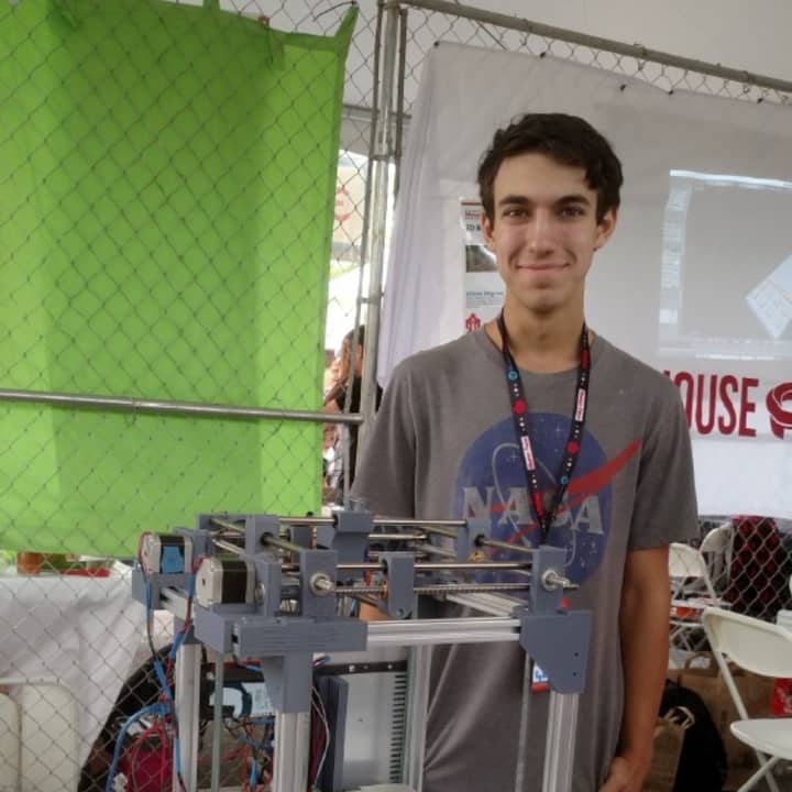 Hendrick Hudson High School senior Kyle Szendro with his award-winning 3-D printer. 