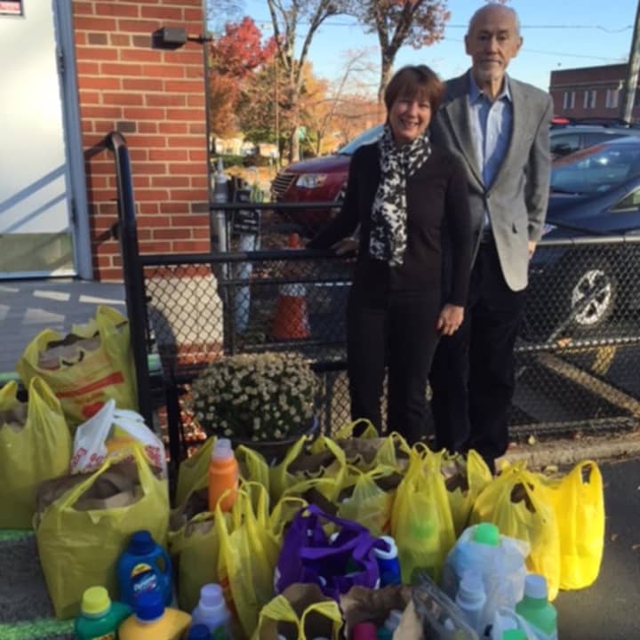 Kate Duggan, Executive Director of Family Promise Bergen County, received from Northern New Jersey Community Foundation&#x27;s President, Michael Shannon, the Foundation&#x27;s collection of laundry detergent for homeless families.