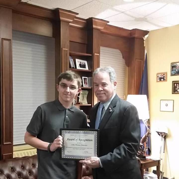 Rockland County Executive Ed Day honors Clarkstown High School North student J.T. Mancino for his winning design submission to the Rockland County Traffic Safety Board.