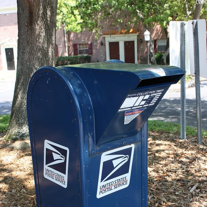 A Long Island man is one of three facing charges for running a multi-million mail scheme.