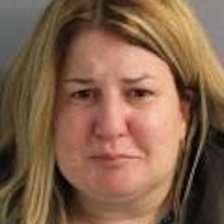 Gina Nelson, 38, of Dover, was charged by state police Sunday with violating a protective order.