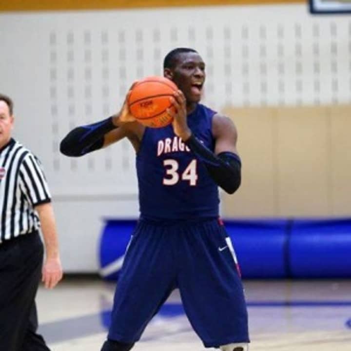 Sunday Okeke, a power forward for the Green Farms Academy&#x27;s Dragons, grew up in Nigeria and is a rising basketball star at the Westport school. .
