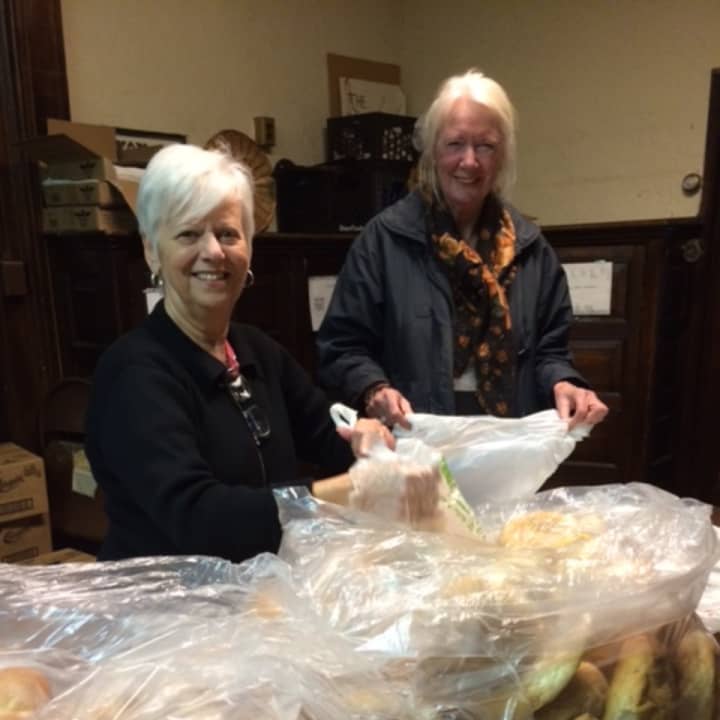 Christina Cafarelli and Karin Chaudhari from Ossining Food Pantry with bags of bread donated by the Ossining Bakery