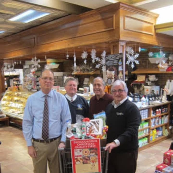 The Pelham Civics Association, with the help of DeCicco &amp; Sons, put together food baskets that will feed hundreds of local residents. From left are: association members Joe Benefico, Joe Nunziata, Rich Davidian, and DeCicco founder John DeCicco Sr. 