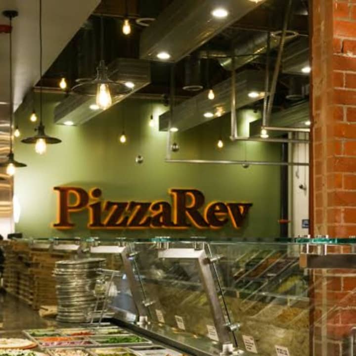 Customers get to choose the fixings for their own pizzas at PizzaRev.