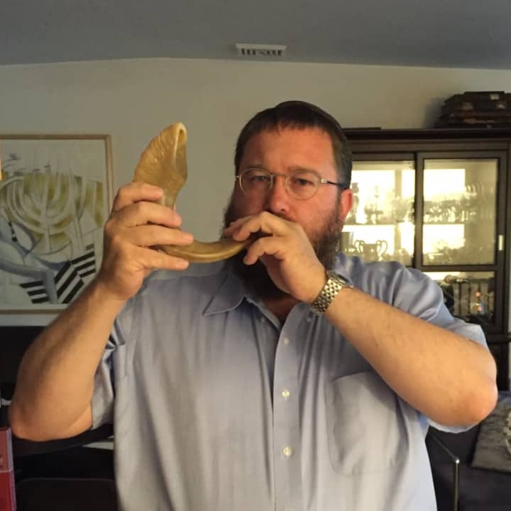 Rabbi Levi Stone of the Schneerson Center for Jewish Life blows the shofar as is customary in the weeks before Rosh Hashanah to act as a “wakeup call” that the holidays are approaching.
