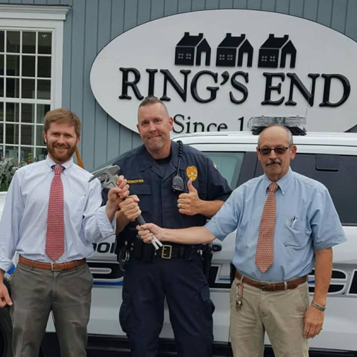 Sgt. Robert Pennoyer, along with Richard Clyne, right, and Rob Campbell Jr. of Ring&#x27;s End, shows off one of the 10 wrecking bars the store donated to police. Clyne and Campbell organized the donation.
