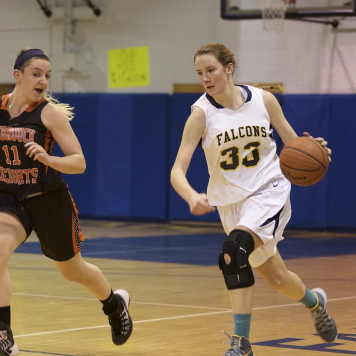 Saddle Brook&#x27;s Brianna Brooks drives around a Hasbrouck Heights defender for the basketball team.
