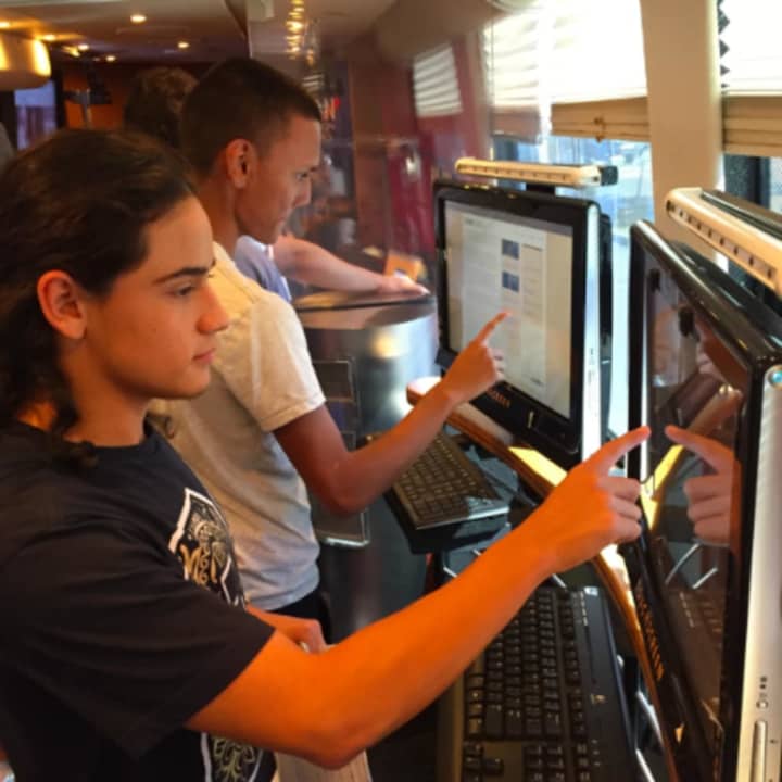 Juan Ramirez, left, and Alex Recinos, right, Grade 12 students at Westhill High School on the C-SPAN Campaign 2016 Bus that was at the school on Thursday. The bus travels the country visiting schools, universities and political events.