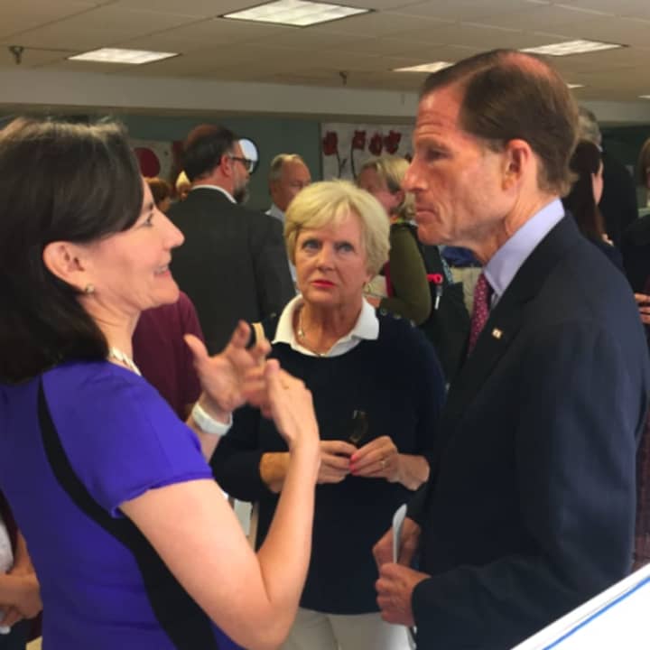 U.S. Sen. Richard Blumenthal listens as Catalina Samper Horak speaks after a discussion on the Syrian refugee crisis while Ginny Fox, center, looks on. He spoke at Neighbors Link in Stamford on Monday morning.