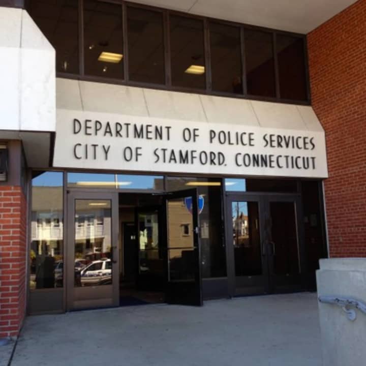 A Stamford Police officer suffered injuries after his police cruiser was &quot;t-boned&quot; by a driver Saturday. A Stamford woman is facing charges that left with the officer with injuries. The extent of the injuries was unknown.