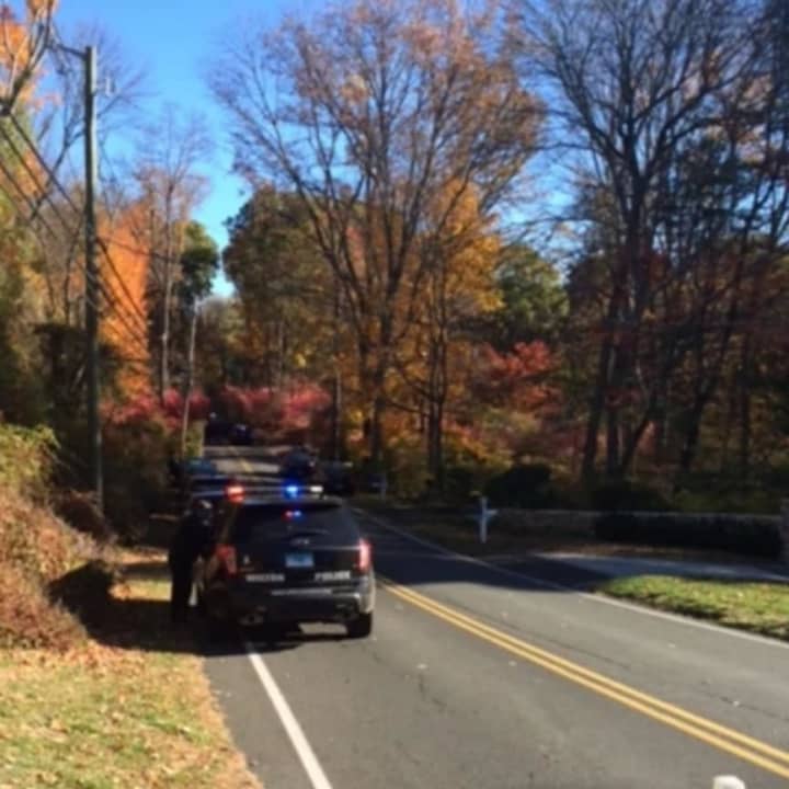 Police block Norfield Road in Weston as the investigation continues Friday into human remains found on an abandoned property. 