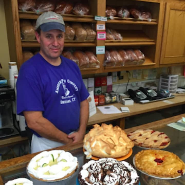 Bill Hunniford, co-owner of the American Pie Co. in Sherman, stands behind some of the restaurant&#x27;s pies.