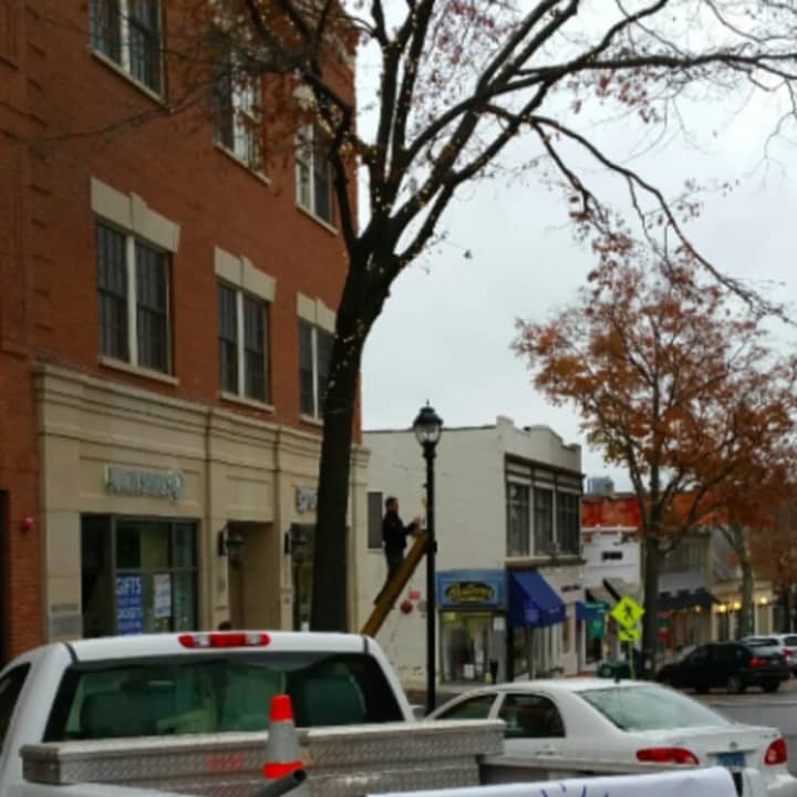Holiday lights being put up on Greenwich Avenue