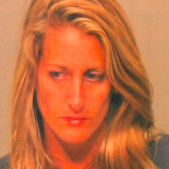 Keri Lynne Devlin, 33, of 17 Circle Ext. Drive in Cos Cob is facing numerous charges after allegedly assaulting two family members,