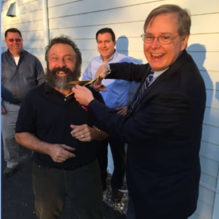 Mayor David Martin playfully threatens to cut of Curtain Call&#x27;s Executive Director Lou Ursone&#x27;s beard at the official opening of the Dressing Room Theatre&#x27;s addition on Friday. Ursone will play Tevye from Fiddler on the Roof in a Bridgeport show.