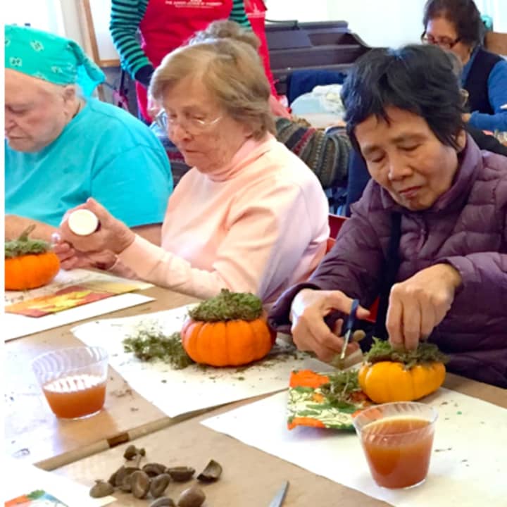Greenwich Catholic School students volunteer to create autumn Décor with local seniors.