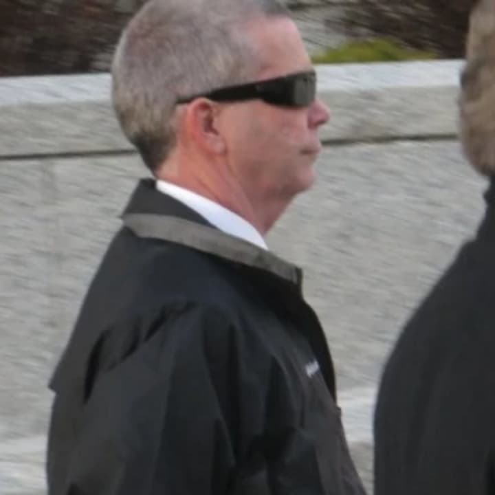 Ex-Mount Pleasant Police Chief Brian Fanelli leaves U.S. District Court in White Plains with defense attorney Michael Burke on Wednesday. Fanelli was sentenced to 18 months in federal prison on a child pornography charge, commencing April 20.