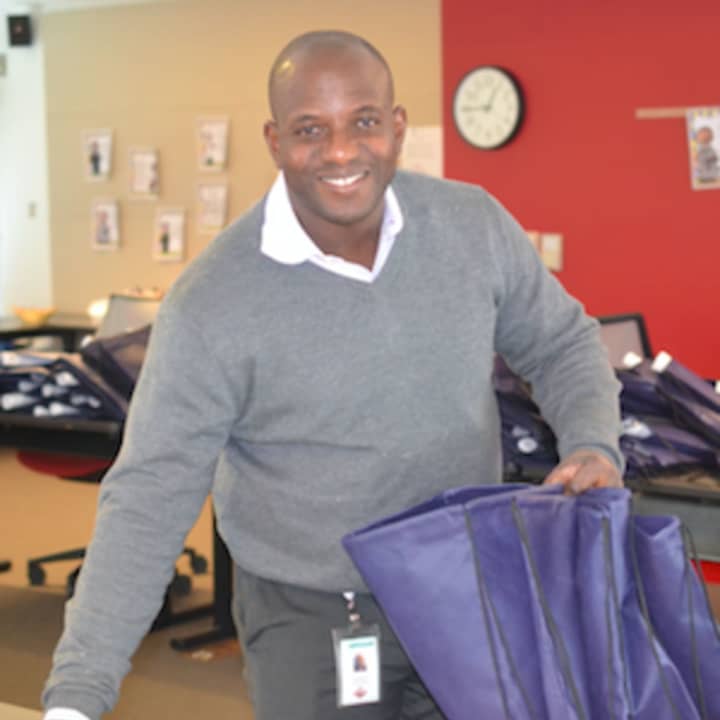 Kehinde Akinyemi was one of the Praxair volunteers who recently assembling literacy kits to benefit first-grade students of Park Avenue School.