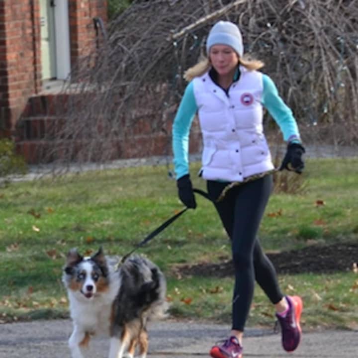 Anne McDonnell takes a dog for a run in Ridgewood.
