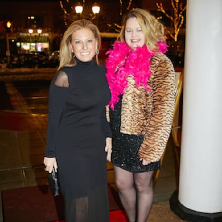 Two guests at Avon Theatre&#x27;s 2015 Oscar party. The theater will host an Oscar party Sunday night.